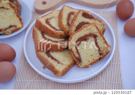 sponge cake on a white plate with beautiful decoration sponge cake on a white plate with beautiful decoration 120530187
