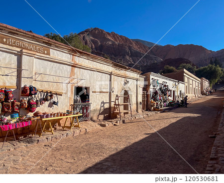 Purmamarca's streetscape with colourful handicraft markets. 120530681