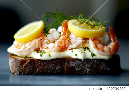 Danish smorrebrod traditional open sandwich at Copenhagen food market store. sandwich on display with shrimp seafood, egg, lemon and vegetable. 120530985