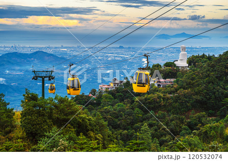 yellow cabanas of a funicular on a cable car in mountains at the Ba Na Hills amusement park in Da Nang, Vietnam at sunset yellow cabanas of a funicular on a cable car in mountains at the Ba Na Hills amusement park in Da Nang, Vietnam at sunset 120532074