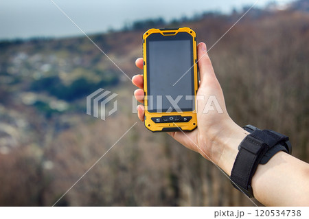 hand of girl with smartwatch and smartphone 120534738