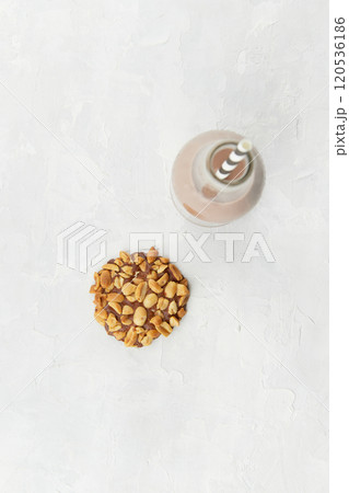 Top view of Portugues traditional penut cookie known as Bolachas de Amendoim with a bottle of milk 120536186
