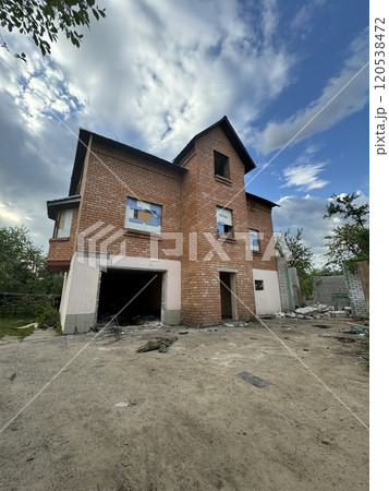 Abandoned Brick House Under a Cloudy Sky Abandoned Brick House Under a Cloudy Sky 120538472
