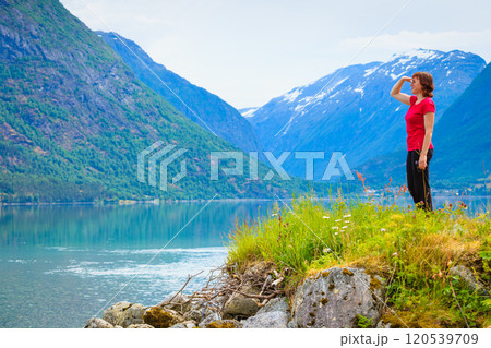 Tourist woman enjoying fjord view in Norway 120539709