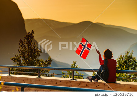Tourist enjoy fjord view on Stegastein viewpoint Norway 120539716