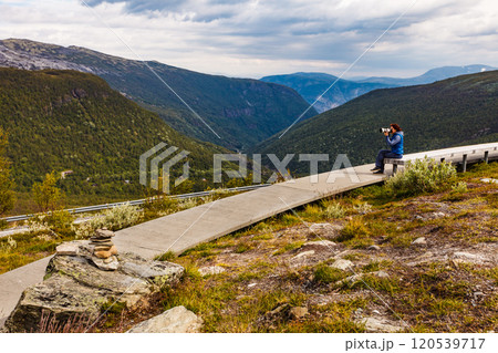Woman on Vedahaugane rest stop, Norway 120539717