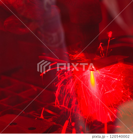 Laser cutting steel metal with bright sparks 120540002