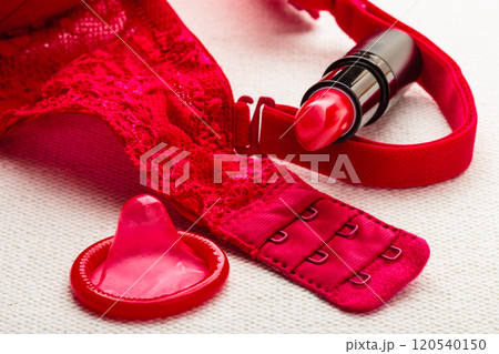 Lipstick and condom with lace lingerie. 120540150