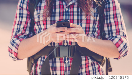 Man outdoor using cell phone 120540176