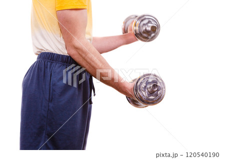 Man exercising with dumbbells lifting weights 120540190