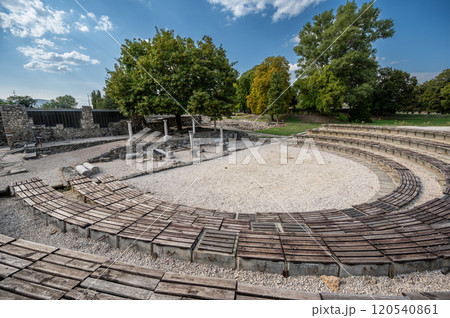 Budapest, Hungary. August 27, 2022. Roman amphitheater in Aquincum the ancient Roman city, now an archaeological site and museum. Travel destinations. Budapest, Hungary. August 27, 2022. Roman amphitheater in Aquincum the ancient Roman city, now an archaeological site and museum. Travel destinations. 120540861