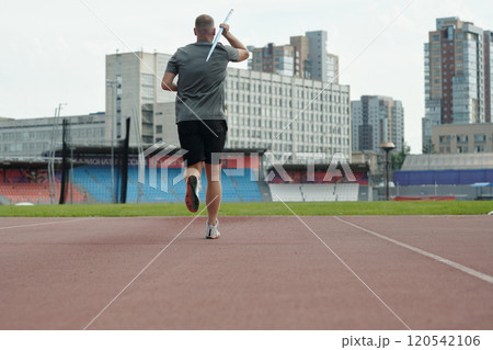 Athlete Running and Preparing for Javelin Throw Practice Athlete Running and Preparing for Javelin Throw Practice 120542106