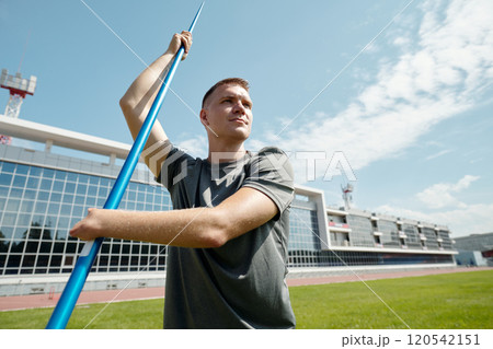 Athlete Throwing Javelin on Athletics Field Athlete Throwing Javelin on Athletics Field 120542151