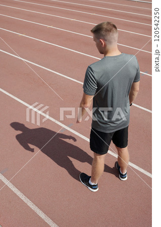 Jogging on Track with Shadow on Surface 120542250