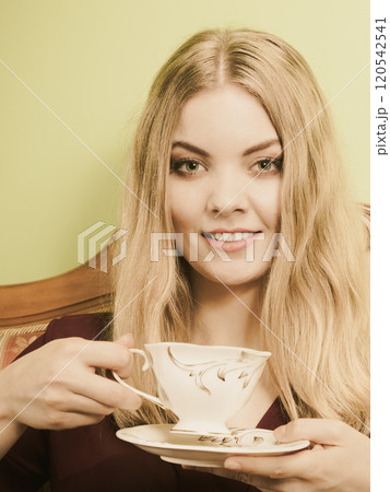 Woman drinking hot coffee beverage. Caffeine. Woman drinking hot coffee beverage. Caffeine. 120542541