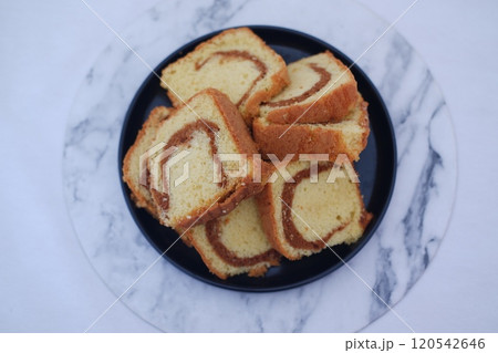 sponge cake on a plate with white background 120542646