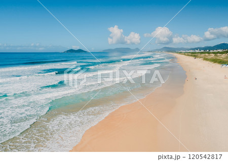 Scenic sandy beach with blue ocean and waves in Floripa. Aerial view of coastline Scenic sandy beach with blue ocean and waves in Floripa. Aerial view of coastline 120542817