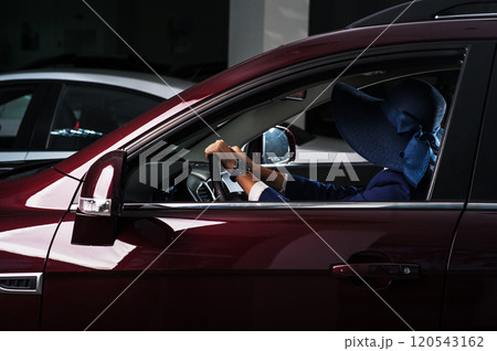 Beautiful girl buys a car 120543162