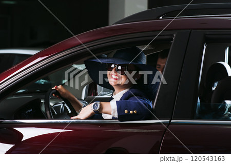 Beautiful girl buys a car 120543163