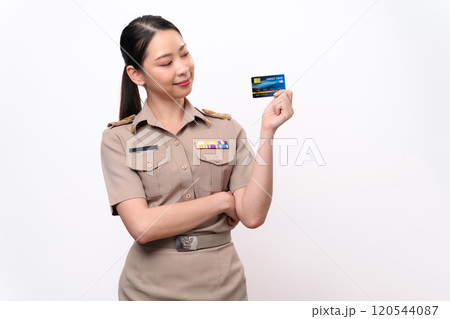 Young Thai Asian Teacher in the uniform is holding the credit card 120544087