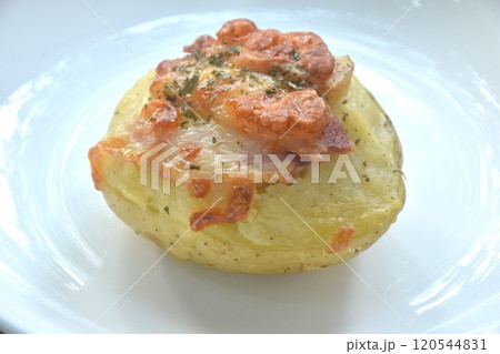 baking potato topping pork bacon with cheese on plate baking potato topping pork bacon with cheese on plate 120544831
