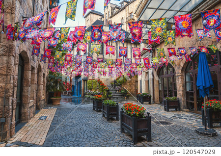 Decorated festive streets of medieval stone town in French village in Ba Na Hills Park in Da Nang in Vietnam 120547029