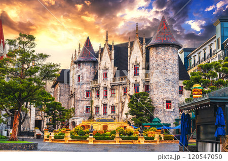 medieval beautiful castle on a square in French village in Ba Na Hills Park in Da Nang, Vietnam at sunset 120547050