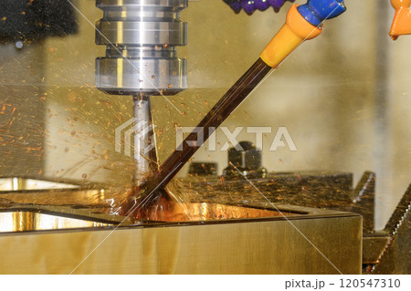 The CNC milling machine rough cutting the mold parts with oil coolant method. The CNC milling machine rough cutting the mold parts with oil coolant method. 120547310