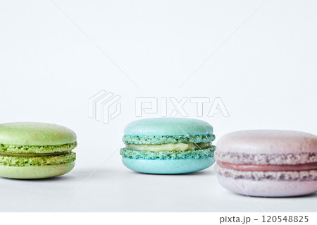 Three colorful French Macarons, macaroons cakes with different flavors Three colorful French Macarons, macaroons cakes with different flavors 120548825