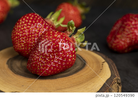 several red sweet strawberries in close-up 120549390