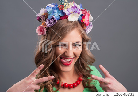 Beautiful girl with a wreath of flowers on her head.Beautiful girl in the flower garden. Princess. Beautiful girl with a wreath of flowers on her head.Beautiful girl in the flower garden. Princess. 120549833