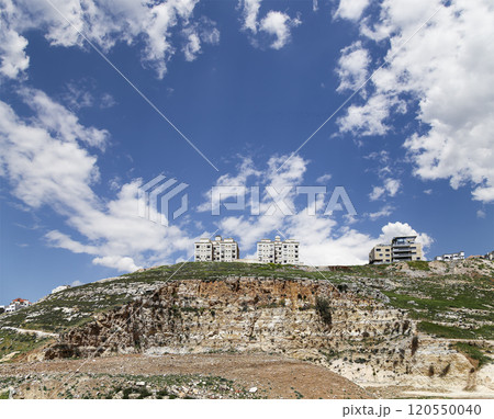 Amman city landmarks-- old roman Citadel Hill, Jordan. Against the background of a beautiful sky with clouds Amman city landmarks-- old roman Citadel Hill, Jordan. Against the background of a beautiful sky with clouds 120550040