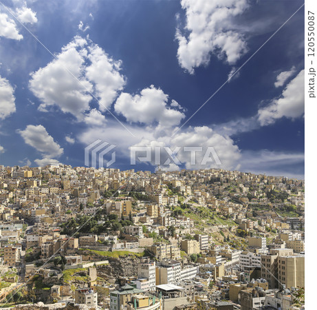 Amman city landmarks-- old roman Citadel Hill, Jordan. Against the background of a beautiful sky with clouds Amman city landmarks-- old roman Citadel Hill, Jordan. Against the background of a beautiful sky with clouds 120550087