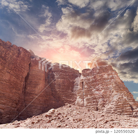 Mountains of Wadi Rum Desert also known as The Valley of the Moon is a valley cut into the sandstone and granite rock in southern Jordan 60 km to the east of Aqaba Mountains of Wadi Rum Desert also known as The Valley of the Moon is a valley cut into the sandstone and granite rock in southern Jordan 60 km to the east of Aqaba 120550320