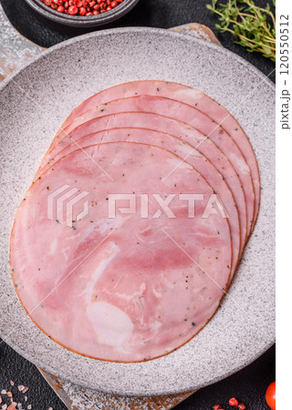 Ham cut into round slices with salt, spices and herbs 120550512