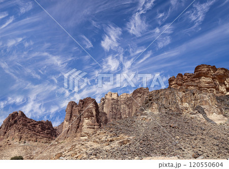 Mountains of Wadi Rum Desert also known as The Valley of the Moon is a valley cut into the sandstone and granite rock in southern Jordan 60 km to the east of Aqaba Mountains of Wadi Rum Desert also known as The Valley of the Moon is a valley cut into the sandstone and granite rock in southern Jordan 60 km to the east of Aqaba 120550604