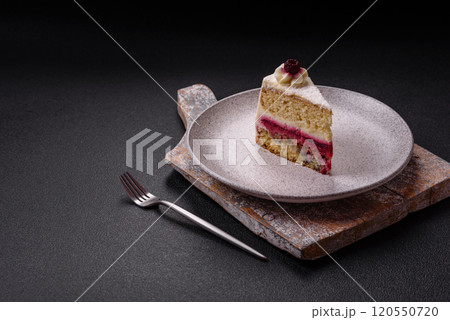 Sweet delicious cake with a layer of raspberry jam 120550720