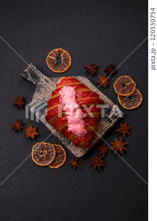 Crispy fresh red croissant with cream and strawberries Crispy fresh red croissant with cream and strawberries 120550754