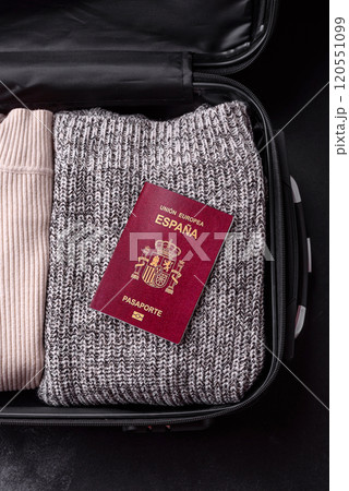 International passport of a citizen of Spain on a suitcase International passport of a citizen of Spain on a suitcase 120551099