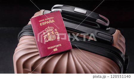 International passport of a citizen of Spain on a suitcase 120551140