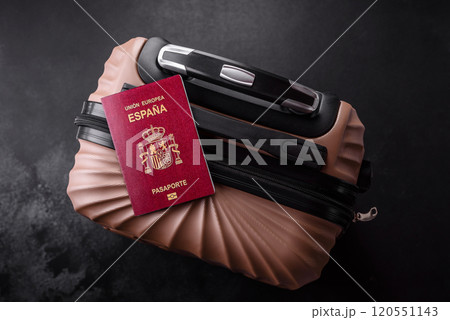 International passport of a citizen of Spain on a suitcase International passport of a citizen of Spain on a suitcase 120551143