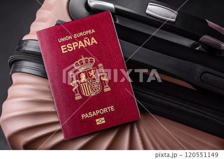 International passport of a citizen of Spain on a suitcase International passport of a citizen of Spain on a suitcase 120551149