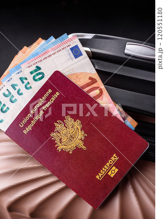 International passport of a French citizen on a suitcase International passport of a French citizen on a suitcase 120551180