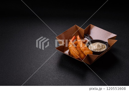 Hot crispy shrimp breaded with salt and spices with white sauce Hot crispy shrimp breaded with salt and spices with white sauce 120551608