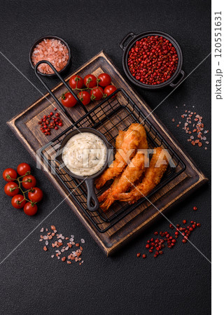 Hot crispy shrimp breaded with salt and spices with white sauce Hot crispy shrimp breaded with salt and spices with white sauce 120551631