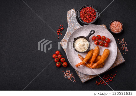Hot crispy shrimp breaded with salt and spices with white sauce Hot crispy shrimp breaded with salt and spices with white sauce 120551632