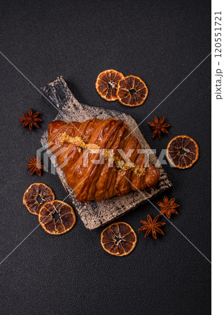 Fresh crispy croissant filled with pistachio cream 120551721