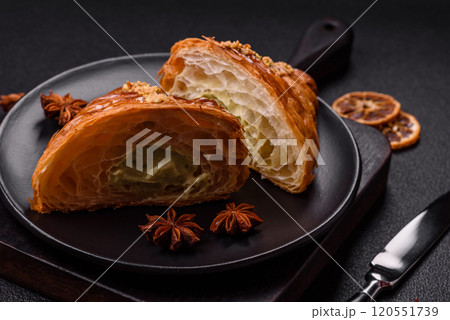 Fresh crispy croissant filled with pistachio cream Fresh crispy croissant filled with pistachio cream 120551739