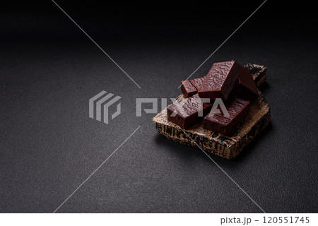 Rectangular chocolate candies with mousse and waffles 120551745
