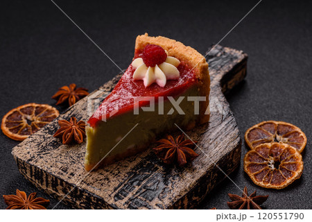 Delicious sweet dessert cheesecake with raspberry and pistachio flavor Delicious sweet dessert cheesecake with raspberry and pistachio flavor 120551790